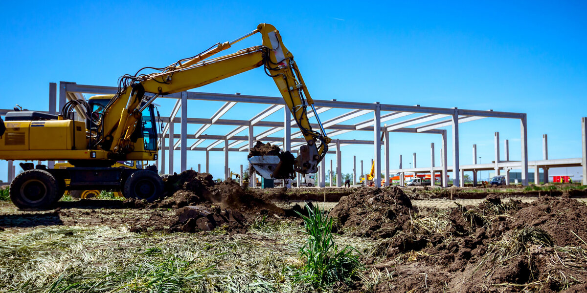 Excavator is digging on building site Baggerarbeiten auf einer Baustelle